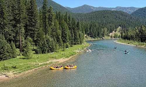 Guests in rafts on Flathead River, Glacier National Park